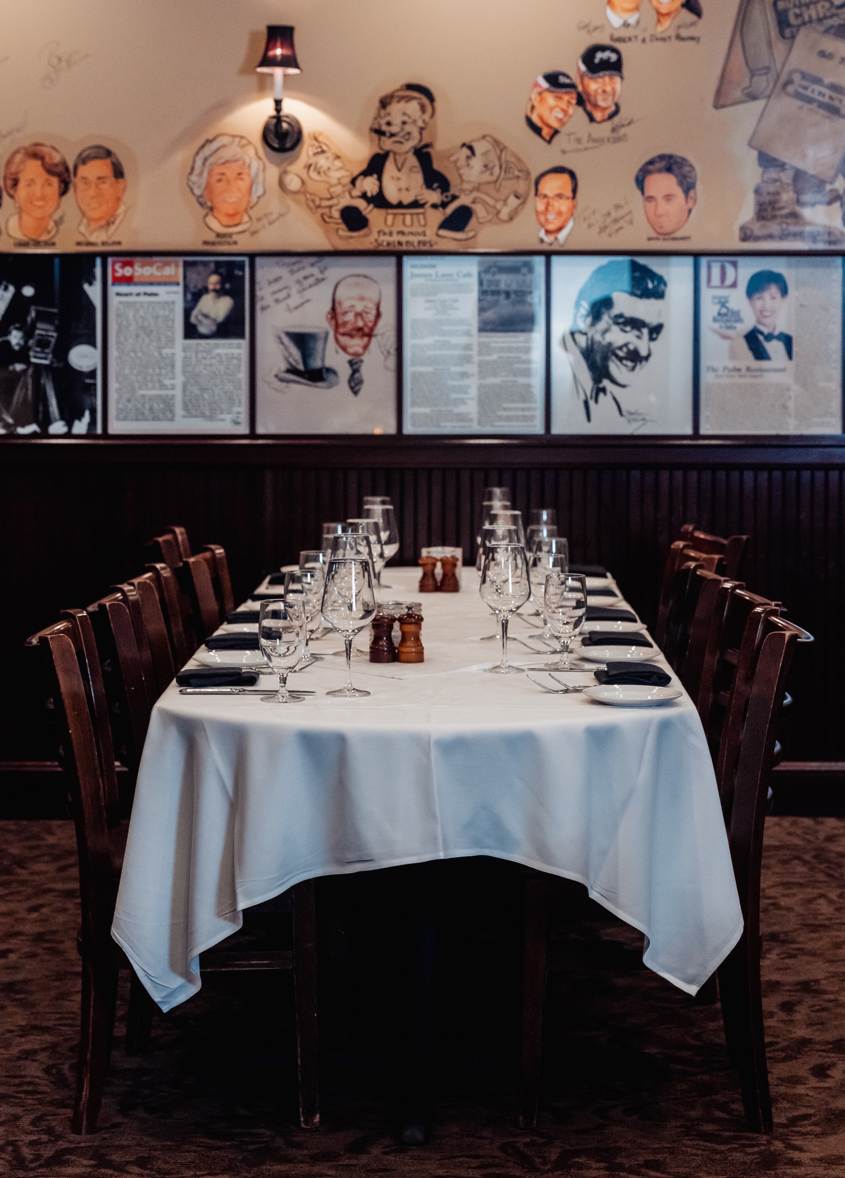 Upscale dining room with vintage memorabilia and elegant table settings